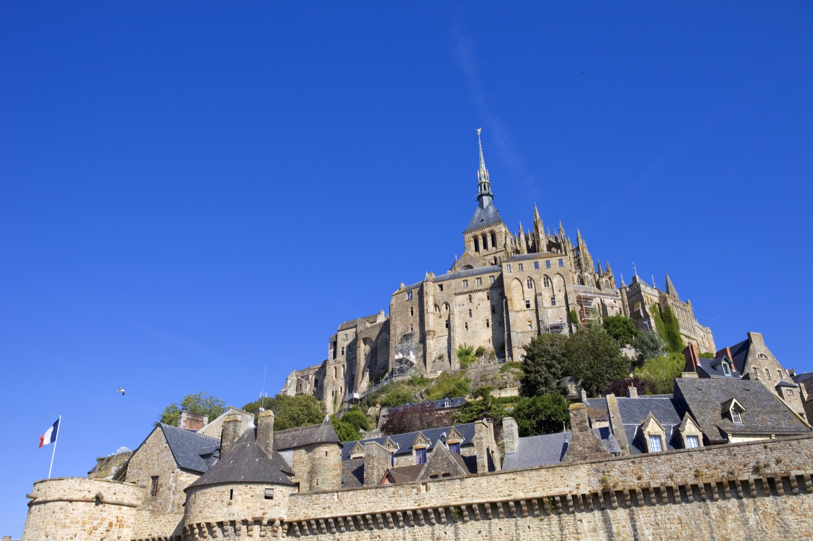 The ramparts and houses of Mont-Saint-Michel below the abbey spire